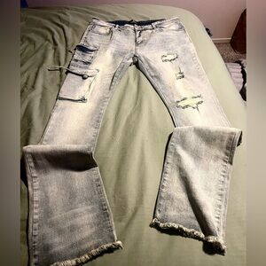 Distressed Light Wash Jeans with Frayed Hem